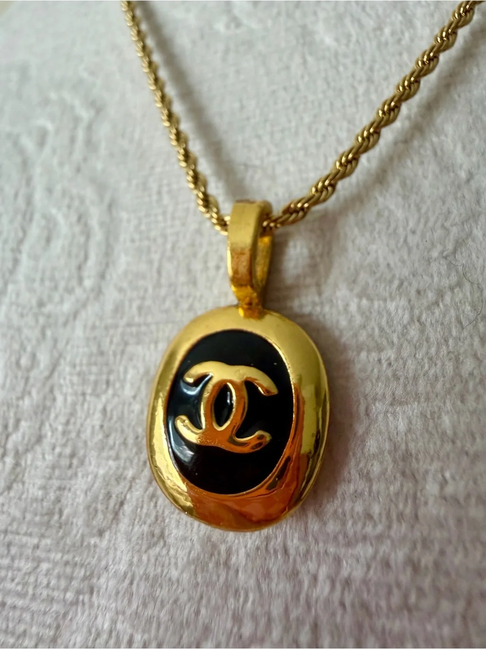 CHANEL Gold and Black Oval CC Pendant Necklace on Rope Chain